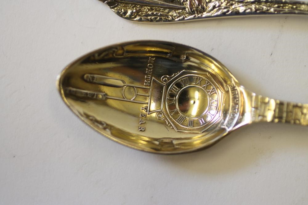 A PAIR OF GILDED SILVER  "BIRTH RECORD" SPOONS Image