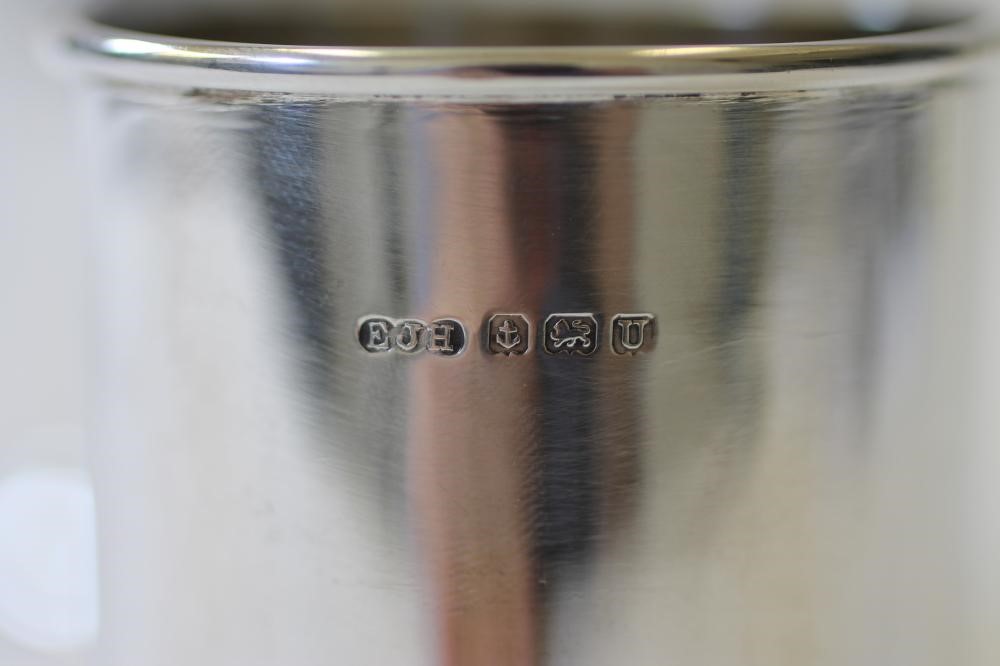 A PAIR OF SILVER SAUCE BOTTLE COASTERS Image