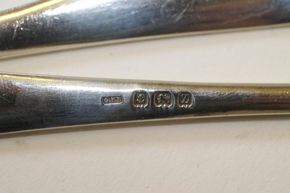 A SET OF SIX SILVER DESSERT SPOONS Image