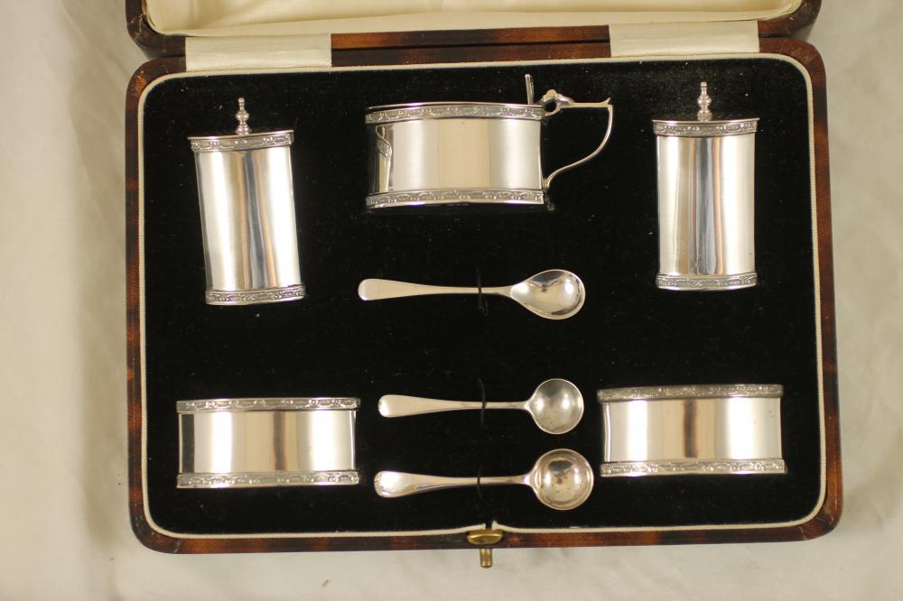 AN ART DECO SILVER FIVE PIECE CRUET Image