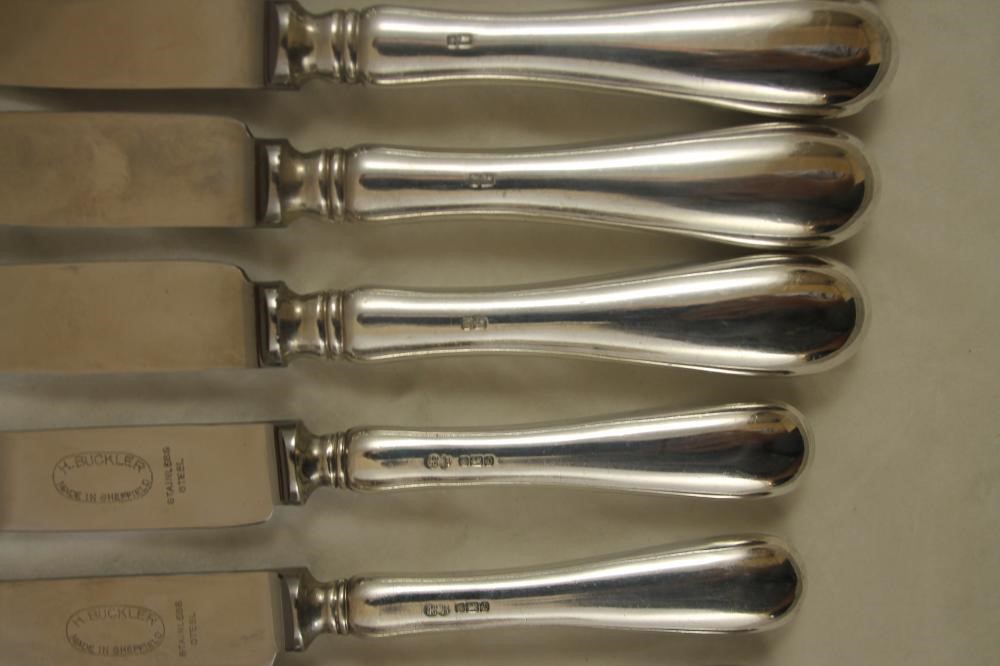 A SET OF SIX EACH TABLE AND DESSERT KNIVES Image