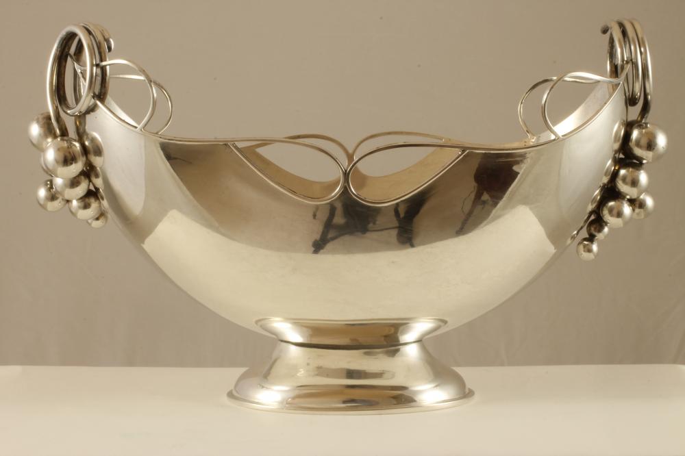 A CONTINENTAL WHITE METAL CENTRE BOWL Image