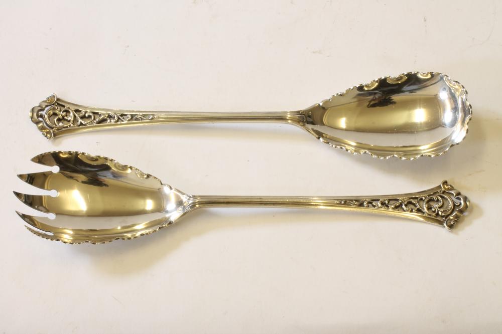 A PAIR OF LATE VICTORIAN SILVER SALAD SERVERS Image