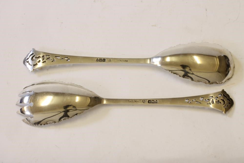 A PAIR OF LATE VICTORIAN SILVER SALAD SERVERS Image