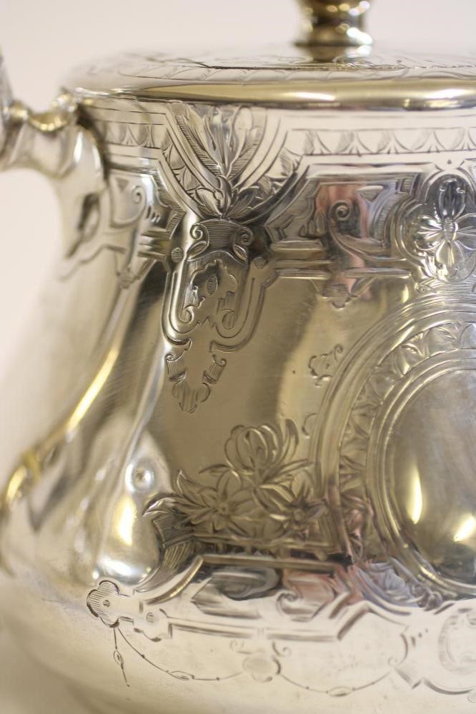 A COMPOSITE MID VICTORIAN SILVER THREE PIECE TEA SERVICE Image