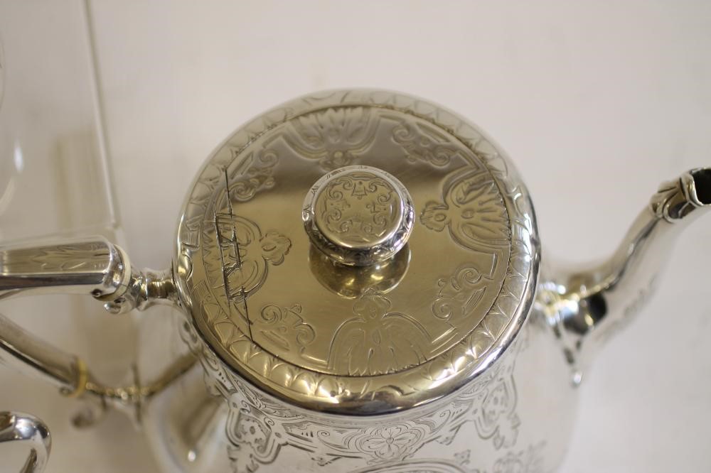 A COMPOSITE MID VICTORIAN SILVER THREE PIECE TEA SERVICE Image