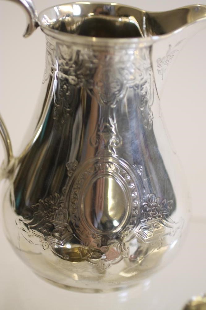 A COMPOSITE MID VICTORIAN SILVER THREE PIECE TEA SERVICE Image