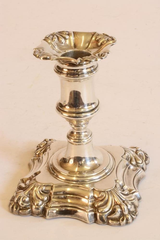 A PAIR OF EARLY VICTORIAN SILVER DWARF CANDLESTICKS Image
