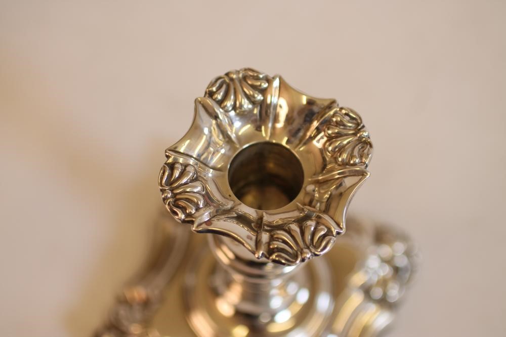 A PAIR OF EARLY VICTORIAN SILVER DWARF CANDLESTICKS Image