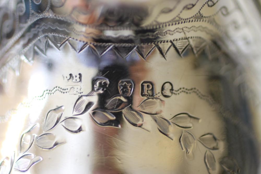 A GEORGE III SILVER HELMET MILK JUG Image