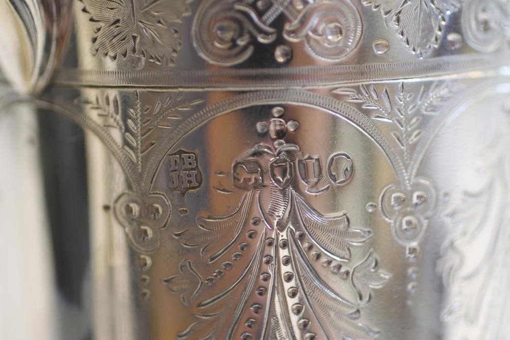 A LATE VICTORIAN SILVER MUG Image