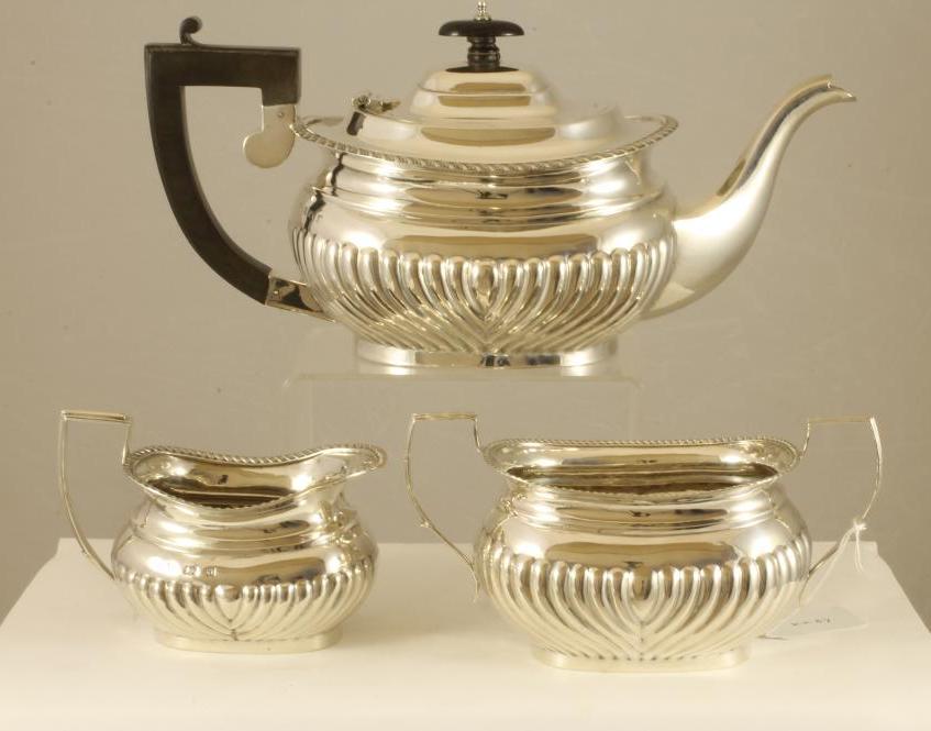 A COMPOSITE THREE PIECE SILVER TEA SERVICE Image