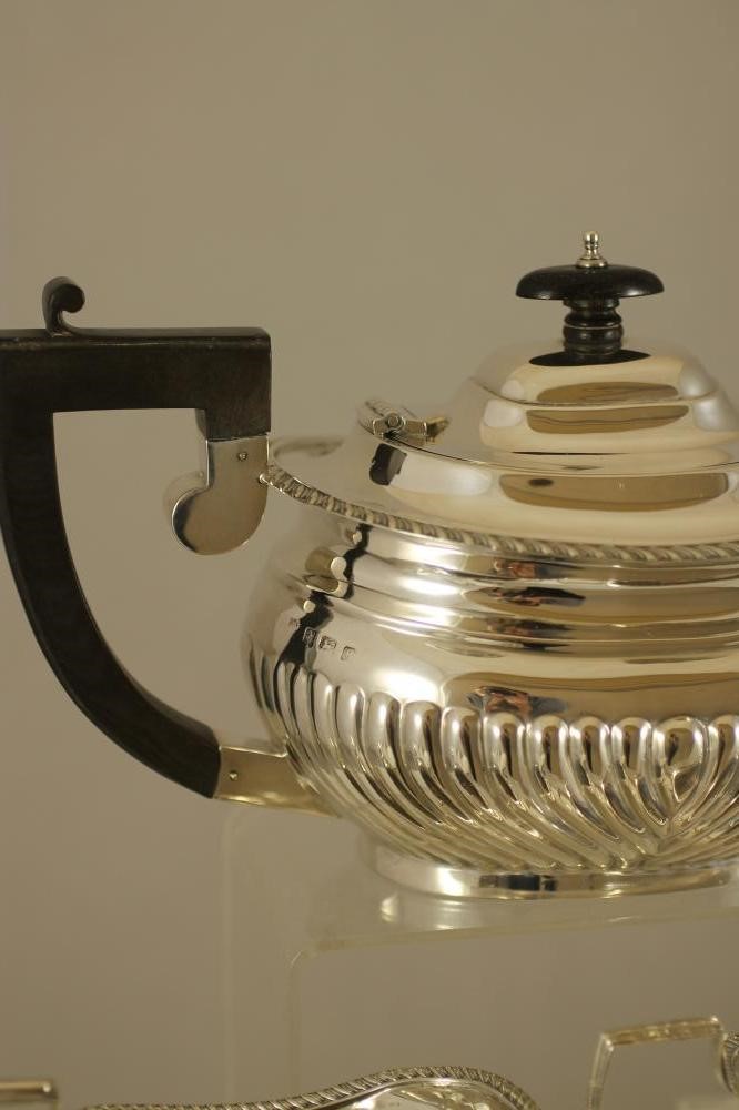 A COMPOSITE THREE PIECE SILVER TEA SERVICE Image