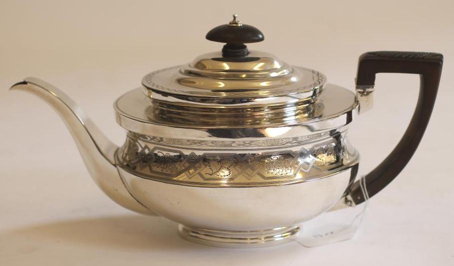A GEORGE III SILVER TEAPOT Image