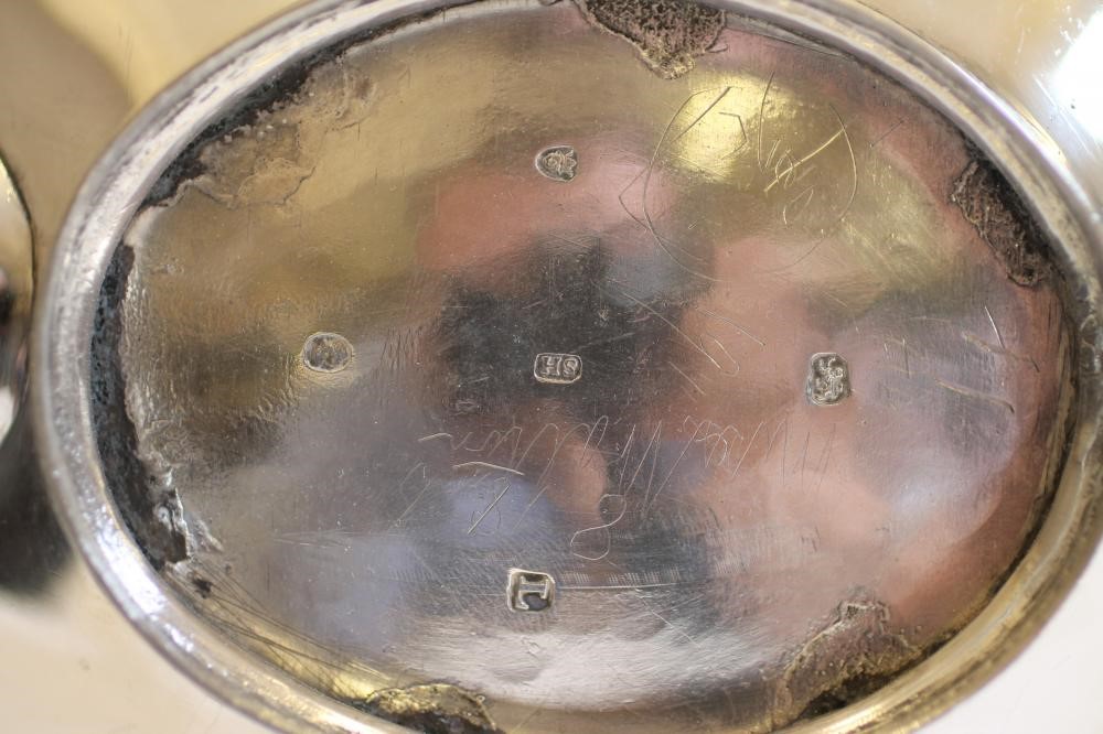 A GEORGE III SILVER TEAPOT Image