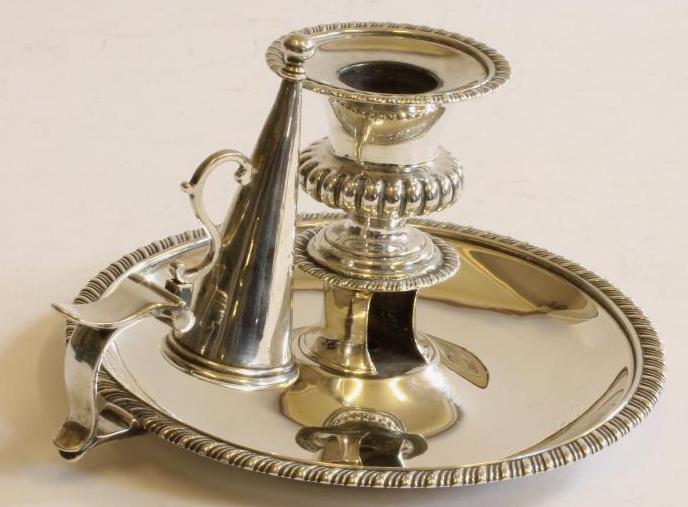 A LATE GEORGE III SILVER CHAMBERSTICK AND EXTINGUISHER Image