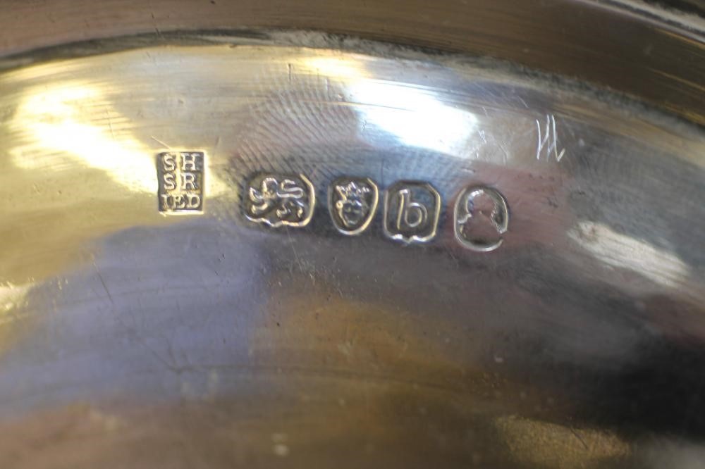 A LATE GEORGE III SILVER CHAMBERSTICK AND EXTINGUISHER Image