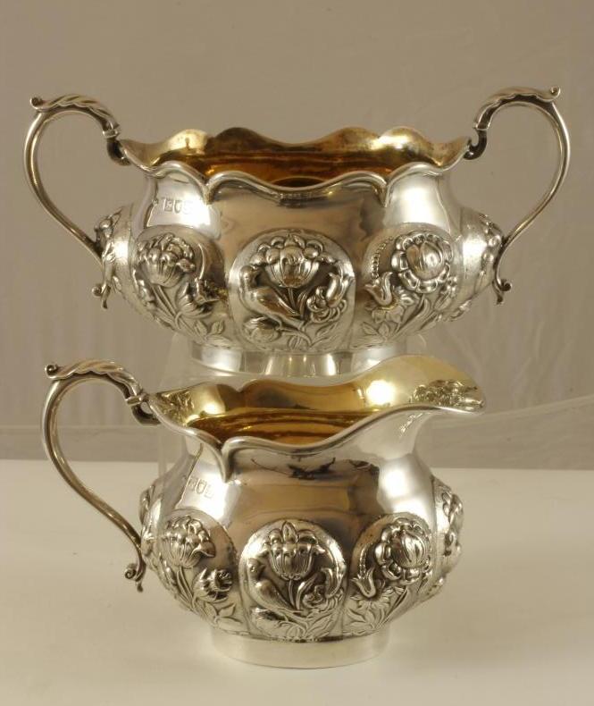 A COMPOSITE EDWARDIAN SILVER MILK JUG AND SUGAR BASIN Image