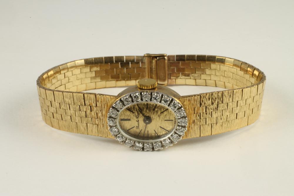 A LADY'S 9CT GOLD AND DIAMOND BUECHE GIROD WRISTWATCH Image