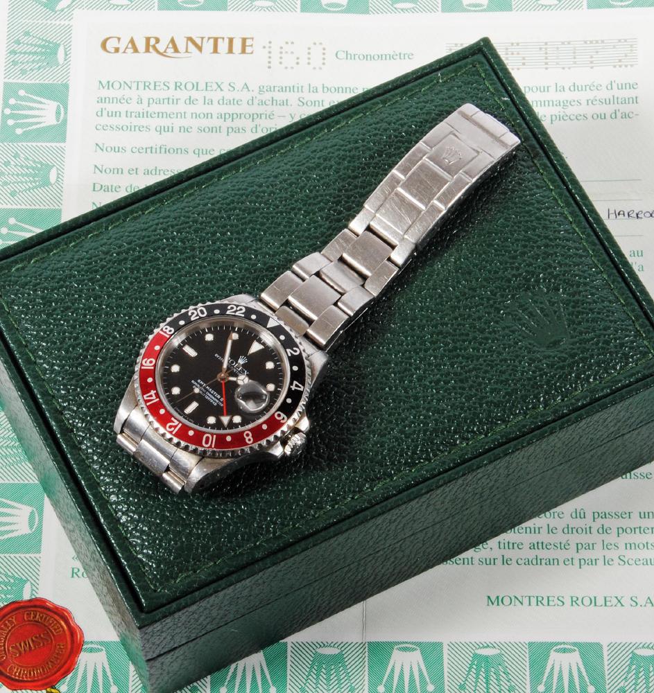A GENTLEMAN'S STAINLESS STEEL ROLEX PERPETUAL DATE GMT MASTER II WRISTWATCH Image