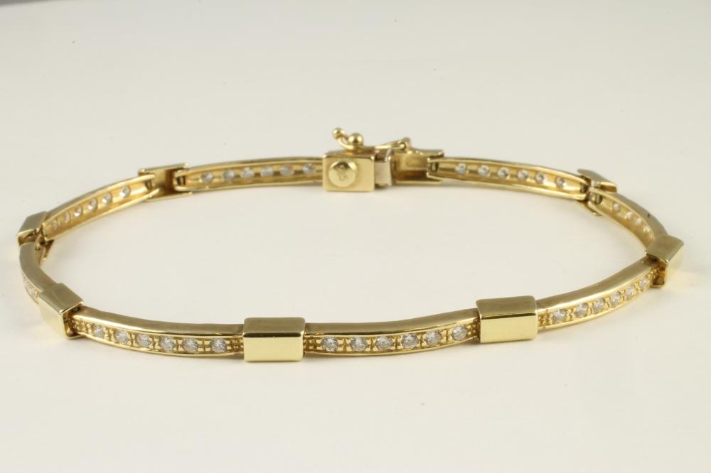 AN ITALIAN 14K GOLD AND DIAMOND BRACELET comprising eight slightly convex slim panels each Image