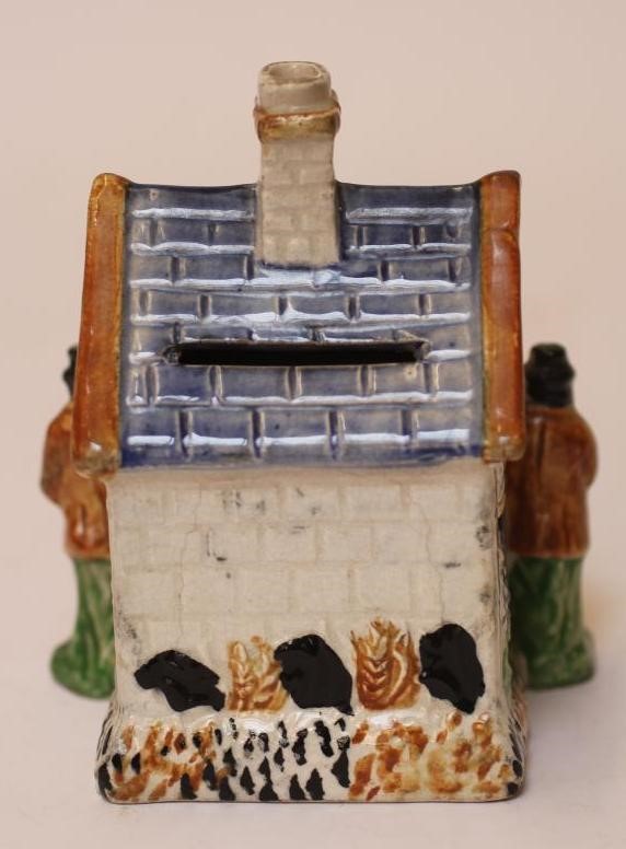 A PRATT TYPE EARTHENWARE MONEY BOX Image