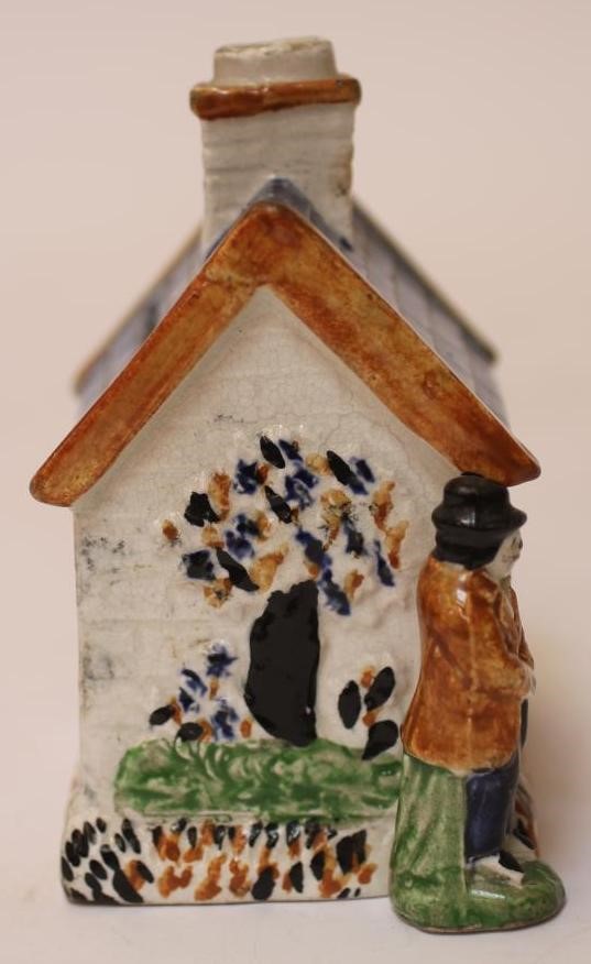 A PRATT TYPE EARTHENWARE MONEY BOX Image