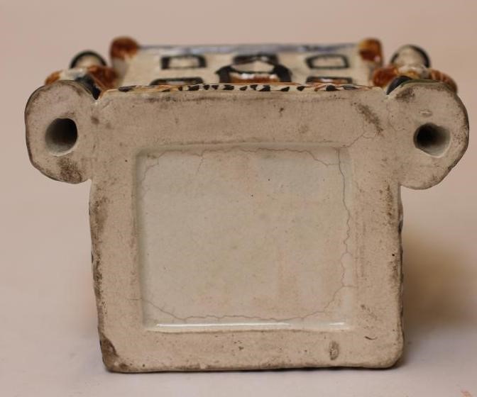 A PRATT TYPE EARTHENWARE MONEY BOX Image