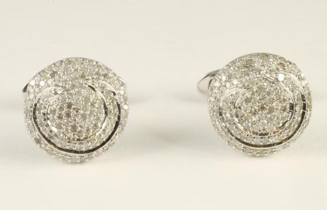 A PAIR OF DIAMOND CUFFLINKS Image
