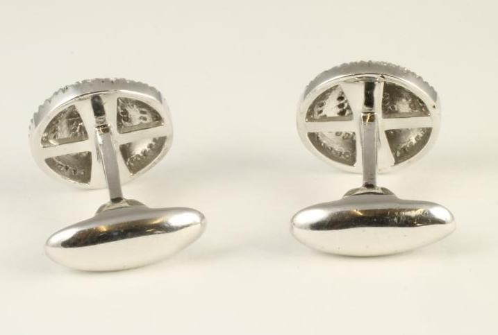 A PAIR OF DIAMOND CUFFLINKS Image