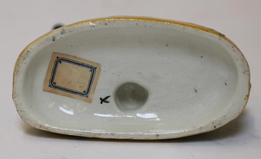 TWO LATE VICTORIAN STAFFORDSHIRE POTTERY MODELS OF RECUMBENT GREYHOUNDS Image