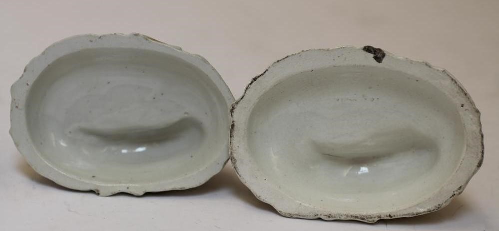 TWO LATE VICTORIAN STAFFORDSHIRE POTTERY MODELS OF RECUMBENT GREYHOUNDS Image