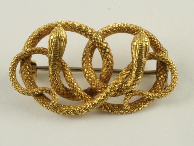 A WILLIAM IV GOLD BROOCH as two entwined serpents with chased scales and features Image
