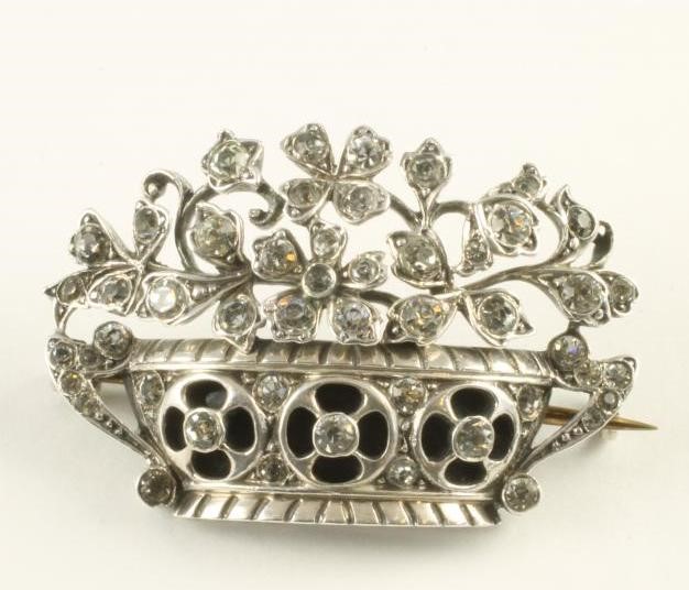 A FRENCH ART DECO SILVER BROOCH modelled as a basket of flowers close back collet set with clear Image