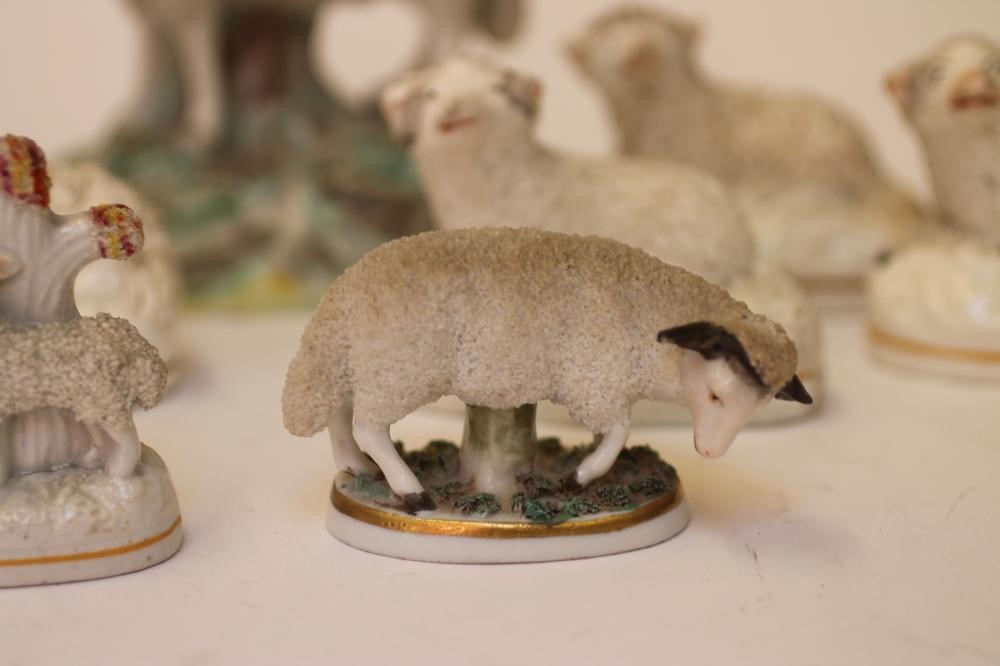 A COLLECTION OF VICTORIAN AND LATER STAFFORDSHIRE POTTERY MODELS of recumbent sheep Image