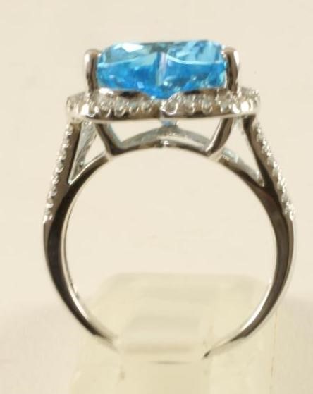 A BLUE TOPAZ AND DIAMOND DRESS RING Image