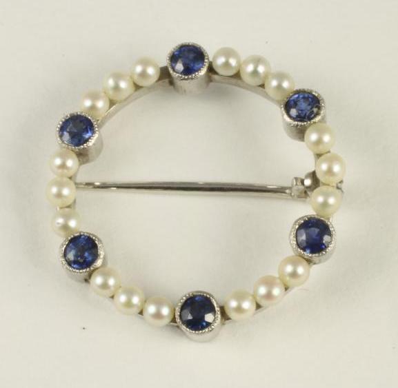 A SEED PEARL AND SAPPHIRE CIRCLET BROOCH Image