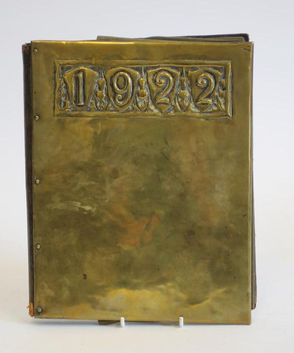 AN ARTS AND CRAFTS LEATHER AND BRASS DESK BLOTTER Image