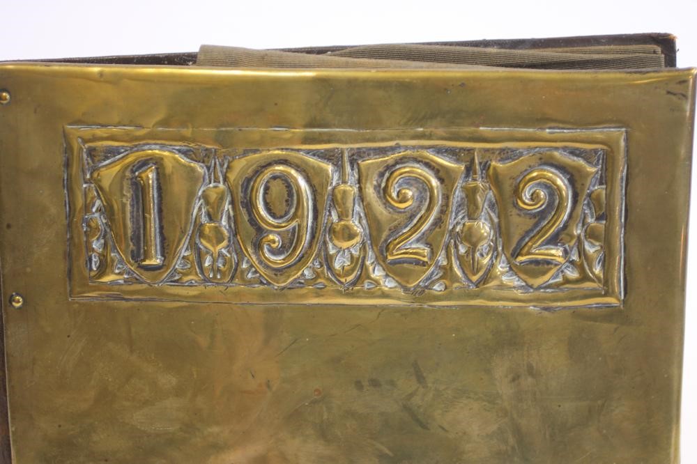 AN ARTS AND CRAFTS LEATHER AND BRASS DESK BLOTTER Image