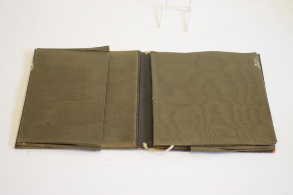 AN ARTS AND CRAFTS LEATHER AND BRASS DESK BLOTTER Image