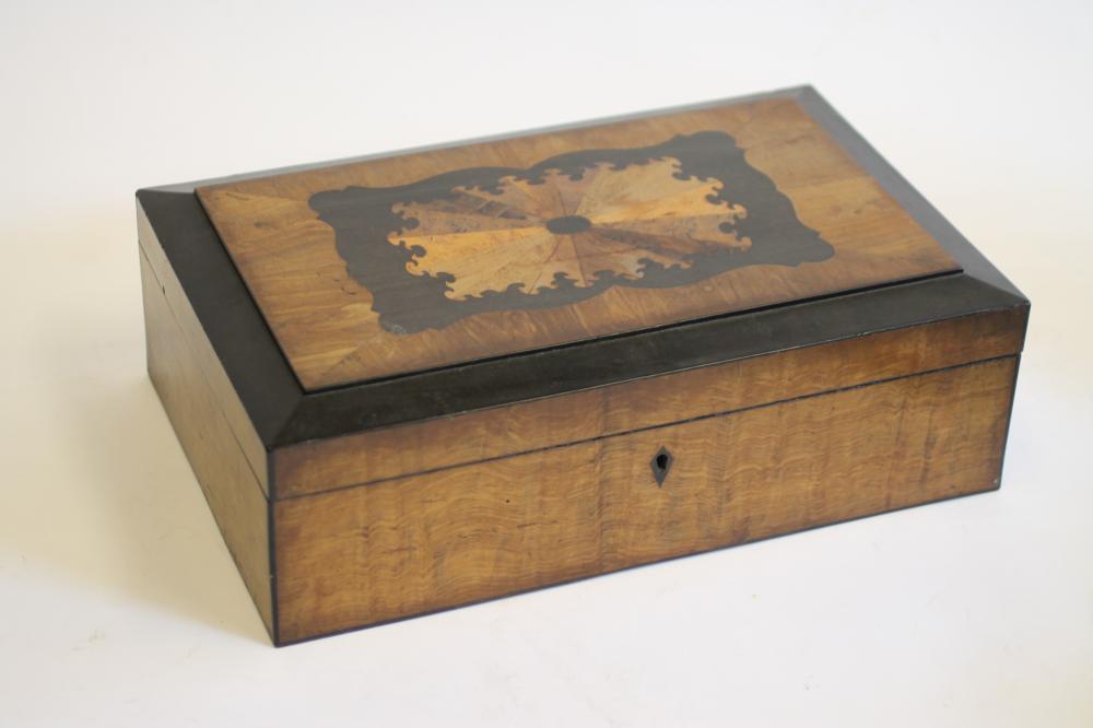 A VICTORIAN WALNUT AND EBONISED TABLE BOX of oblong form Image