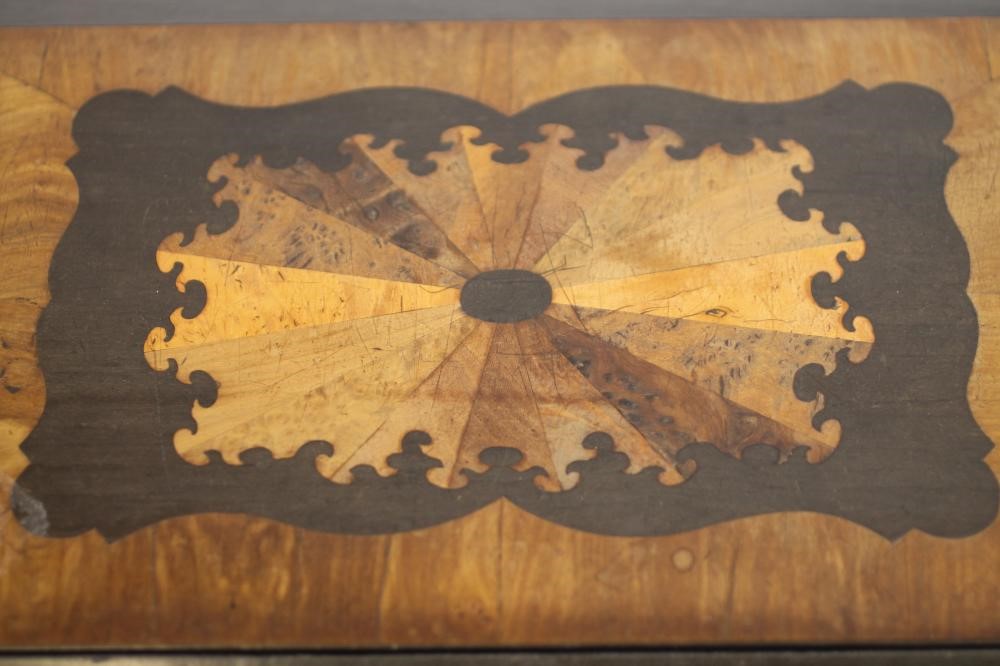 A VICTORIAN WALNUT AND EBONISED TABLE BOX of oblong form Image