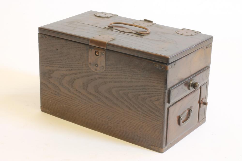 A CHINESE STAINED WOOD WRITING BOX of oblong form with copper mounts and loop handles Image
