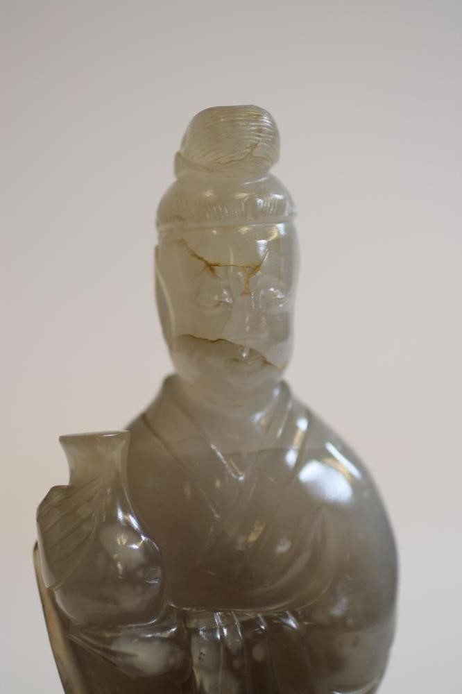 A CHINESE GREY QUARTZ FIGURE Image