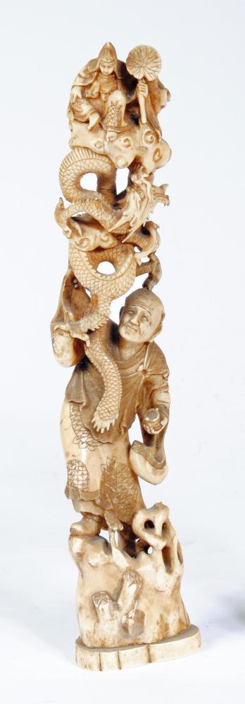 A JAPANESE CARVED IVORY FIGURE GROUP Image