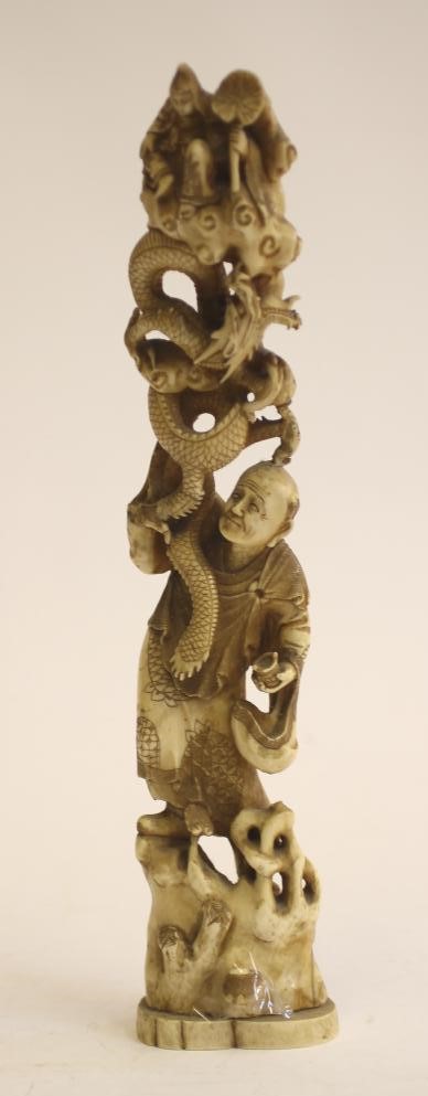 A JAPANESE CARVED IVORY FIGURE GROUP Image