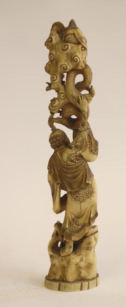 A JAPANESE CARVED IVORY FIGURE GROUP Image