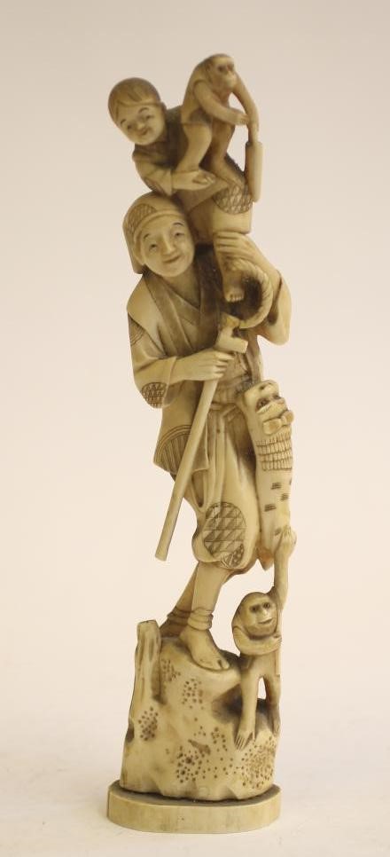 A JAPANESE CARVED IVORY ONE PIECE FIGURE Image