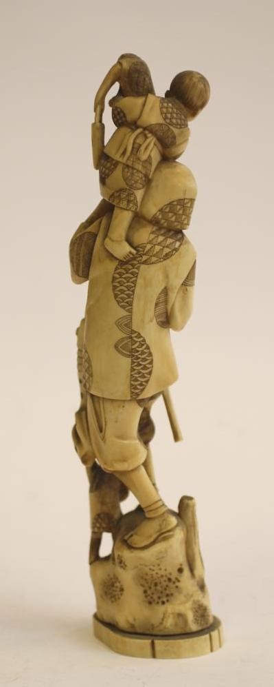 A JAPANESE CARVED IVORY ONE PIECE FIGURE Image