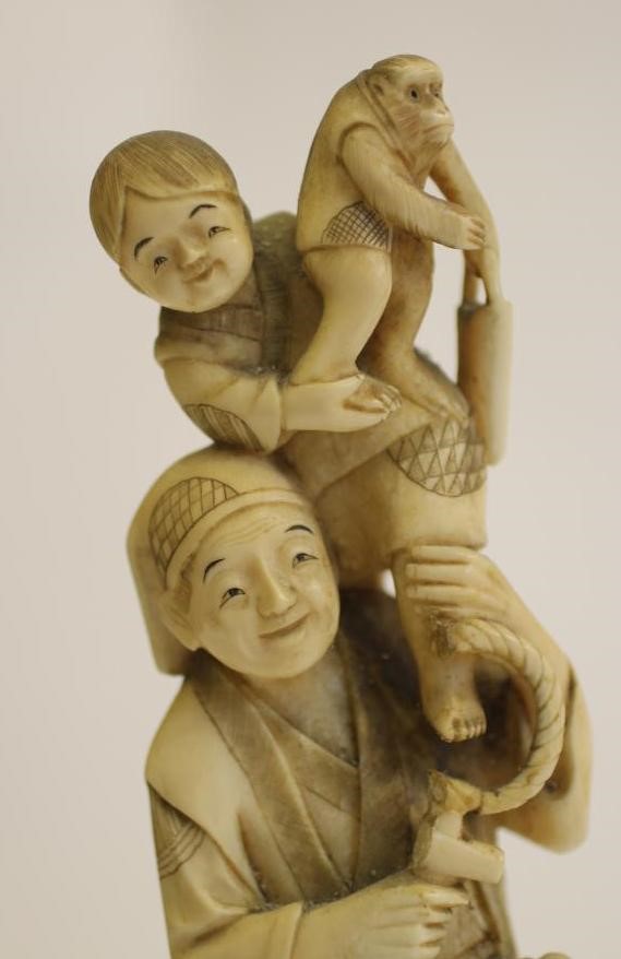 A JAPANESE CARVED IVORY ONE PIECE FIGURE Image